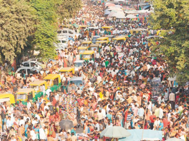 Indian customers walk through the Teen D